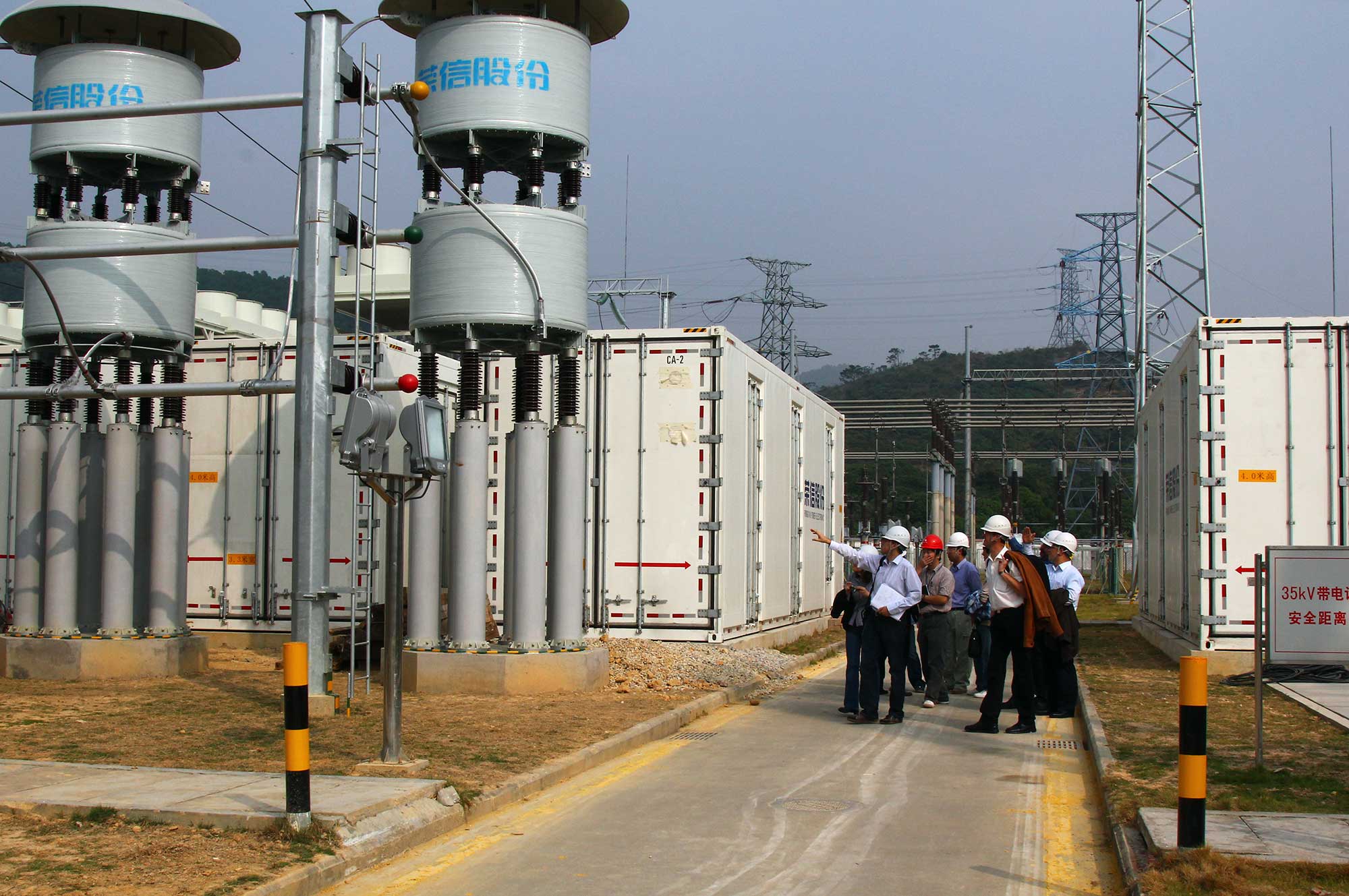 Industry Partnerships - group on-site discussing an installation