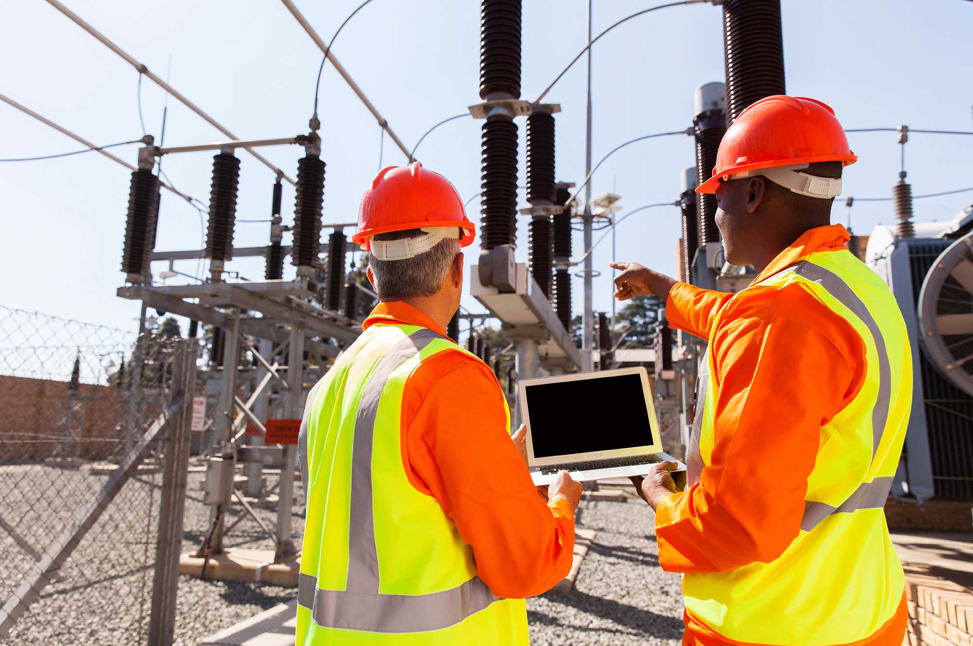 Two engineers with laptop commissioning equipment